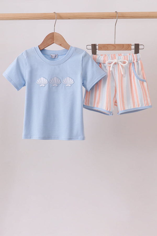 Light blue short-sleeve set with embroidered seashells and pink striped shorts featuring a white drawstring waistband.