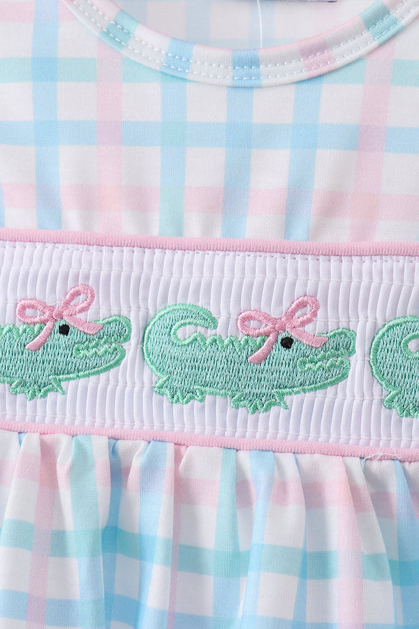 Pink crocodile smocked gingham bloomer set with pastel top and embroidered green crocodile motifs.