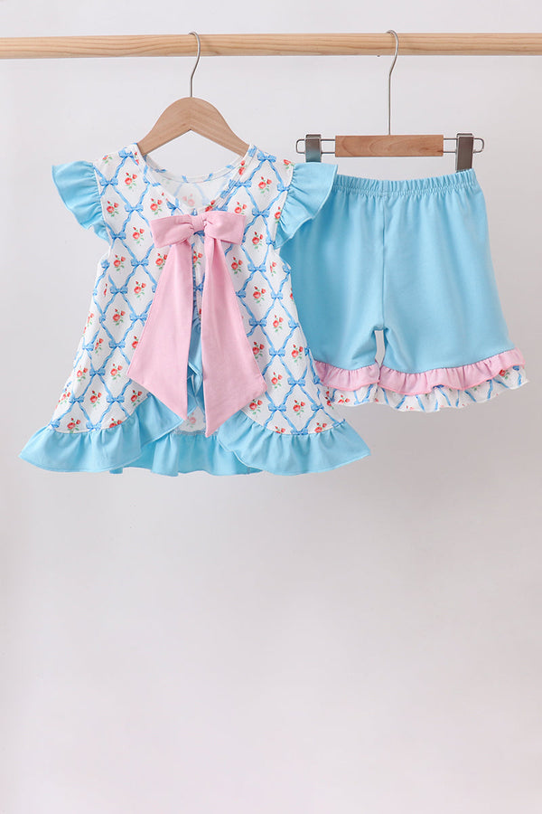 Two-piece blue rose ruffle top with pink bow and matching light-blue shorts with pink trim.