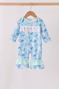 Blue baby romper with goose print, embroidered chest details, bow accents, and mint ruffle leg trim. Soft, comfortable one-piece outfit.
