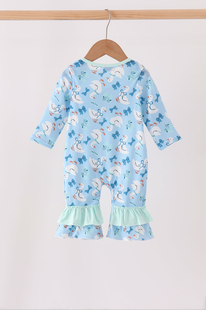 Blue baby romper with goose and bow print, featuring mint ruffled leg cuffs on a wooden hanger. Soft one-piece outfit.