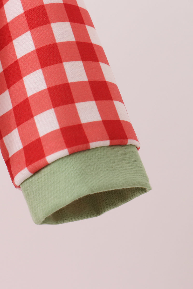 Red gingham baby romper sleeve featuring a soft green cuff and classic checkered pattern for comfortable children's wear.