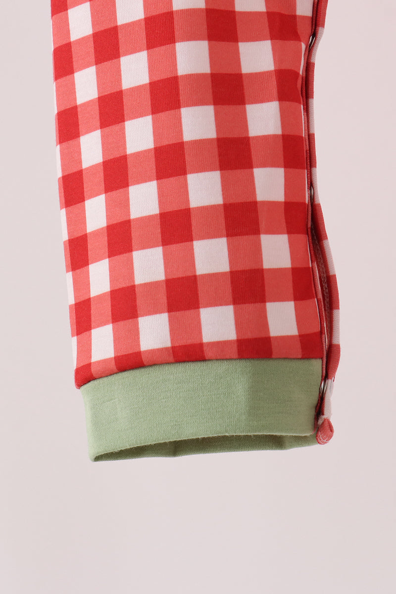 Red gingham romper sleeve detail featuring green ribbed cuff and side ruching for a baby one-piece.