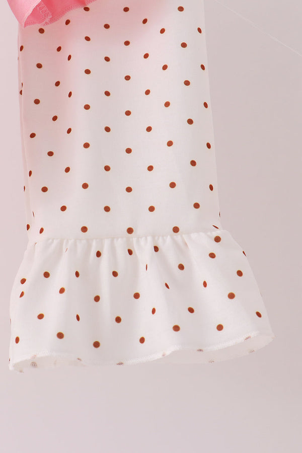 White ruffle pants leg with brown polka dots and pink trim from a turkey applique set for girls.