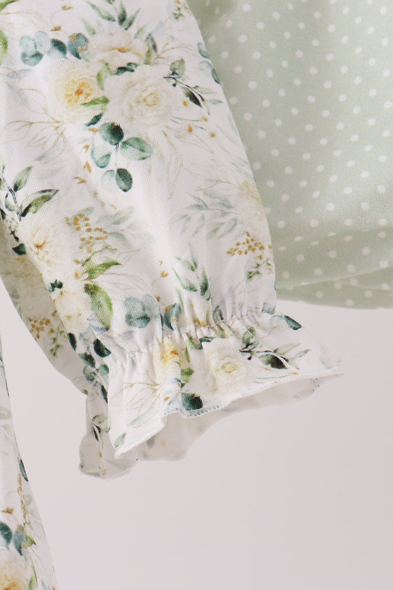 Sage floral smocked ruffle bloomer set featuring delicate floral print, vintage-inspired ruffled hem, and soft green polka dot detail.