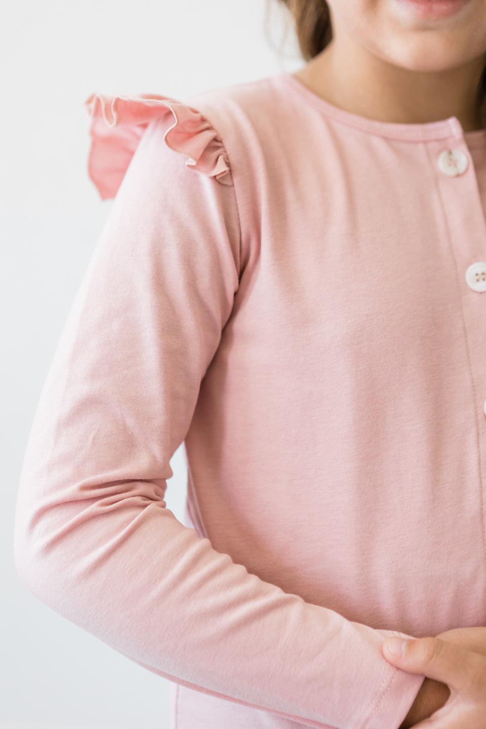 Vintage Pink Ruffle Cardigan featuring charming ruffles on the shoulder, perfect for stylish children's wear.