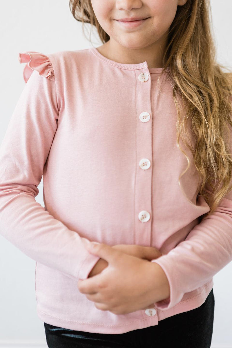 Vintage Pink Ruffle Cardigan with button details and a comfortable fit, ideal for playful kids' fashion.