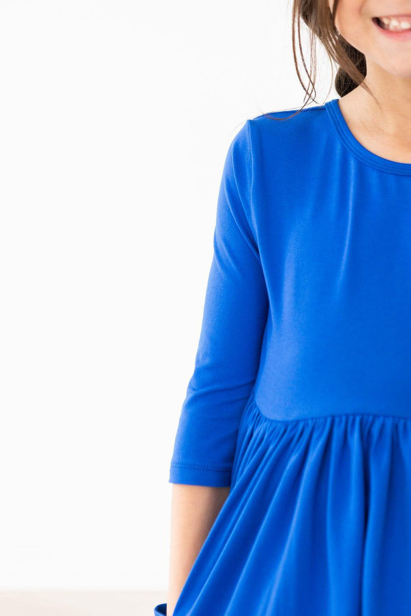 Close-up of the Royal Blue 3/4 Sleeve Pocket Twirl Dress by Mila & Rose, featuring comfy fabric perfect for all-day play!