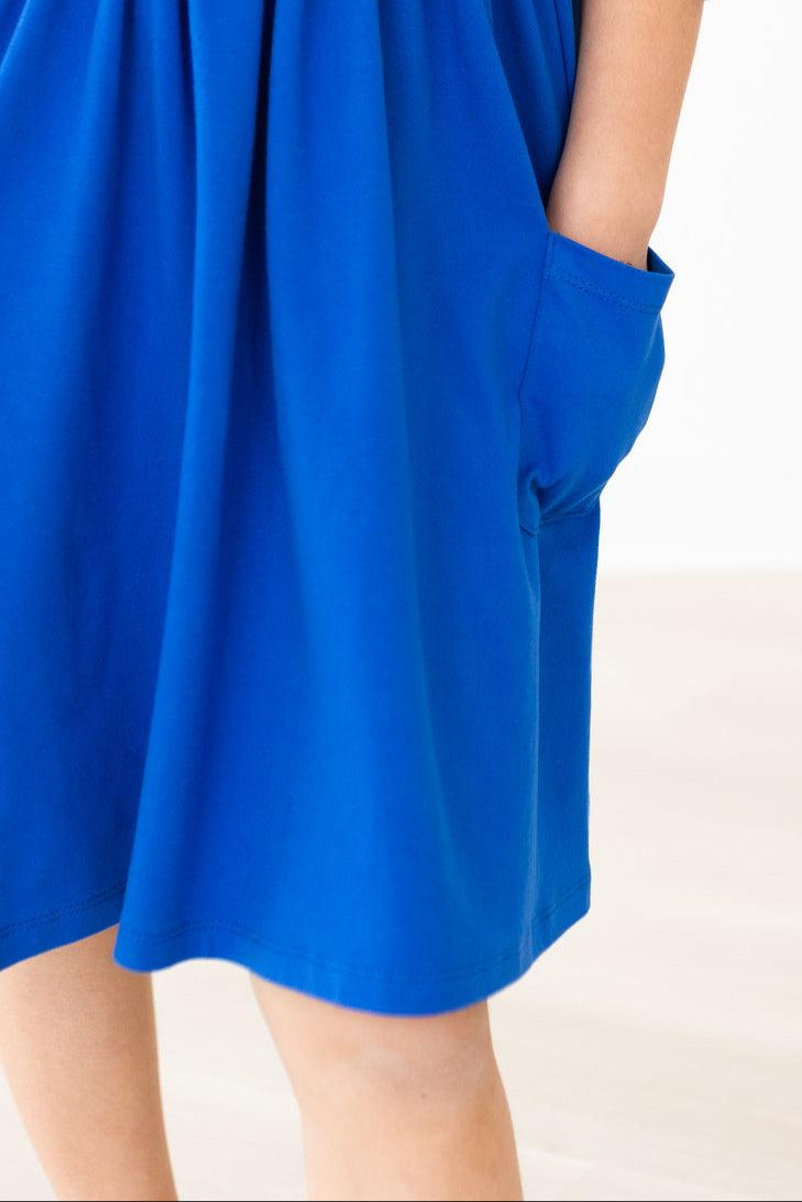 Fun and fashion collide in the Royal Blue 3/4 Sleeve Pocket Twirl Dress by Mila & Rose; watch her spin and shine!