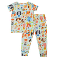 The Second-Skin 2-Piece Short Sleeve Pajama set in pastel dog-print fabric with comfy pants by Mindful Doggos.