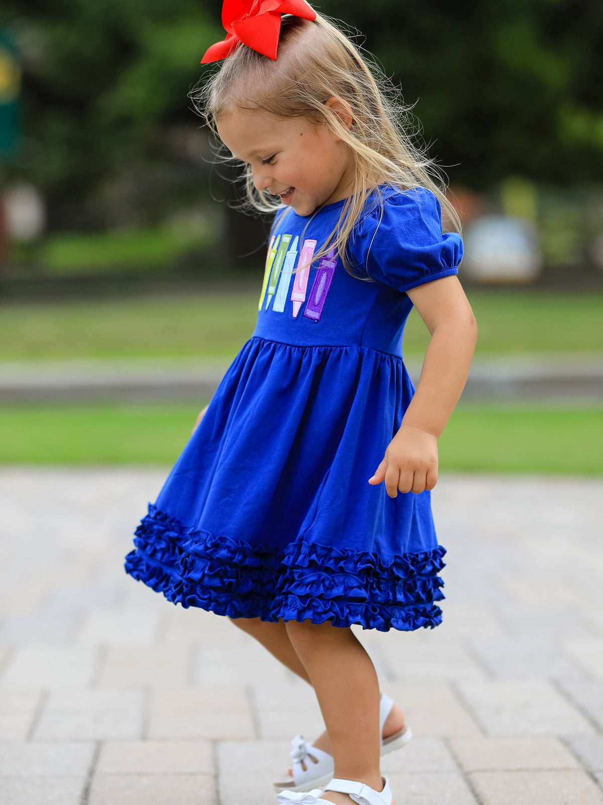 Close-up of stylish ruffle applique on Girls Back To School Crayon Twirl Dress, a standout girls back to school dress.