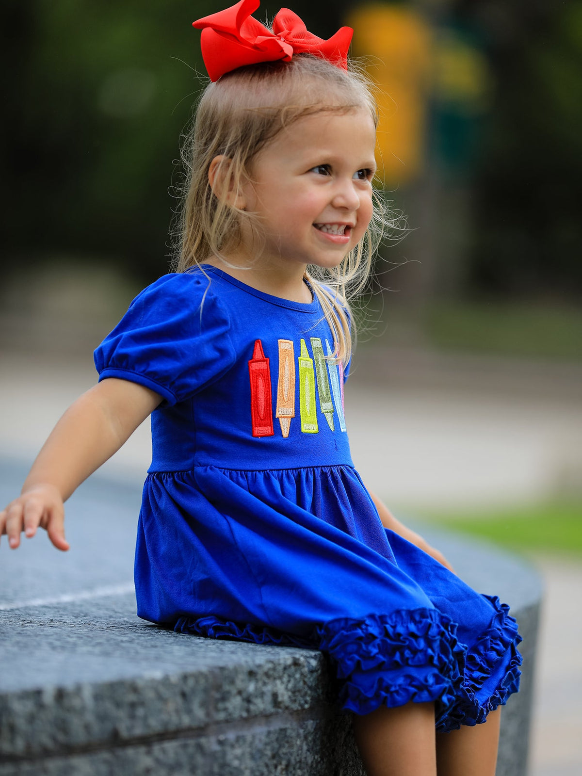 Vibrant crayon print on Girls Back To School Crayon Twirl Dress, the perfect choice for a stylish girls back to school dress.