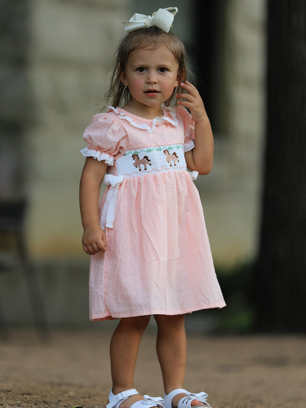 Pink girls dress with puff sleeves, lace collar, and Western horse embroidery on a smocked bodice