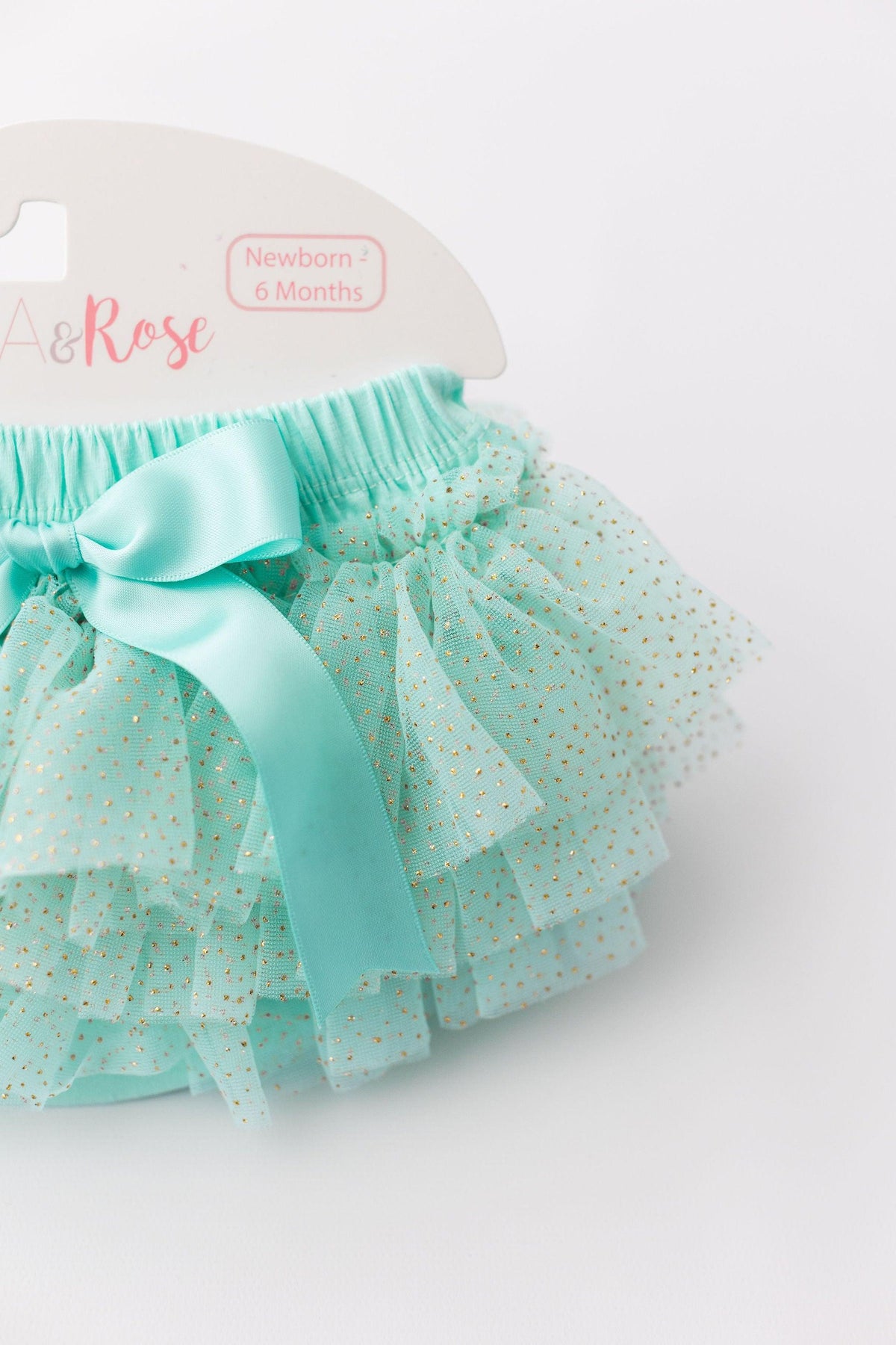 Close-up of the Mint & Gold Glitter Ruffle Tutu Bloomer by Mila & Rose, showcasing the layered ruffles and shimmering gold glitter, ideal for stylish baby outfits.