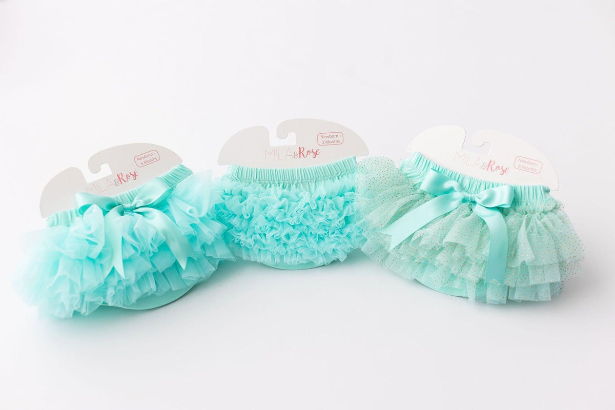 Collection of Mint Ruffle Tutu Bloomers by Mila & Rose®, showcasing fluffy ruffles in various styles, ideal for newborns and infants.