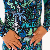 Blue Mystic Mama second-skin 2-piece long-sleeve pajama with You Made Magic print, mother cradling baby.