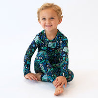 Boy in blue Mystic Mama Second-Skin 2-Piece long-sleeve pajama with vibrant print.