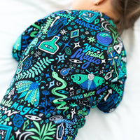 Close-up of The Second-Skin Convertible Romper in Mystic Mama Blue fabric with bold teal print.