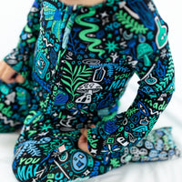 The Second-Skin Convertible Romper in blue by Mystic Mama, bold teal and green print.