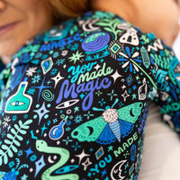 The Second-Skin Footie, Mystic Mama Blue, teal-green doodle print on soft fabric.