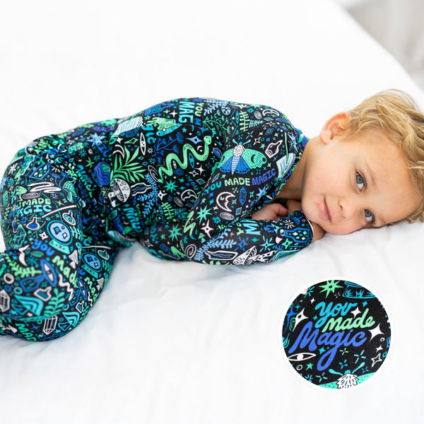 Blue Mystic Mama second-skin 2-piece long-sleeve pajama worn by a child, featuring You Made Magic print.