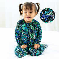 Toddler wearing The Second-Skin Convertible Romper in blue with teal print; inset shows 'You Made Magic' fabric.