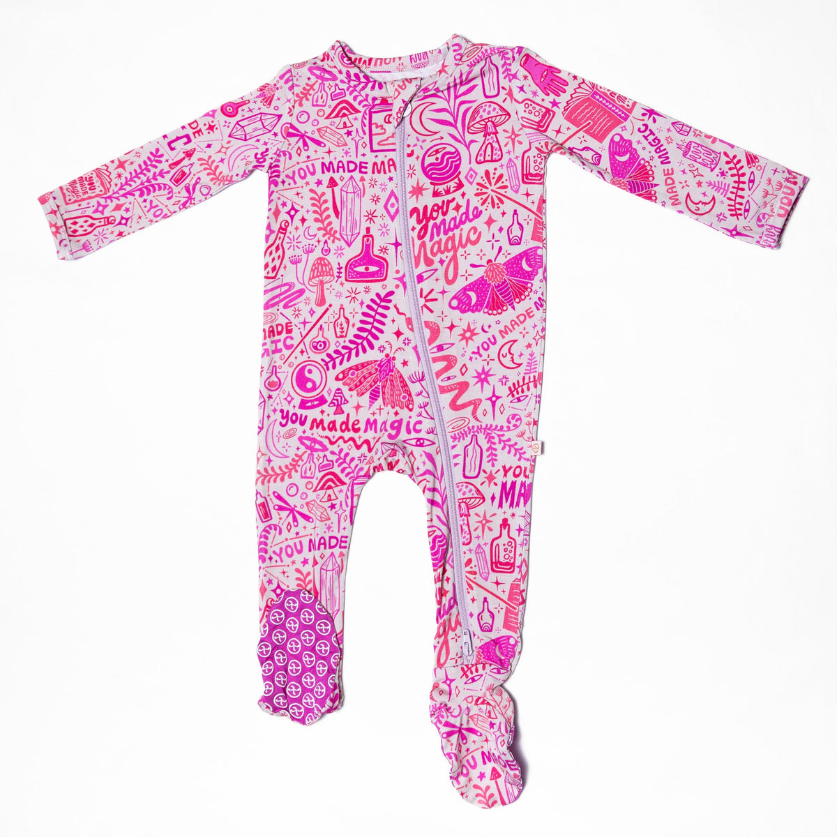 A whimsical presentation of The Second-Skin Bamboo Zippered Footie | Mystic Mama, capturing its soft texture and magical appeal.