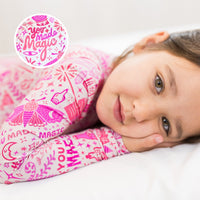 The Second-Skin 2-Piece Long Sleeve Pajama in Pink with You Made Magic print by Mystic Mama, worn by a child.