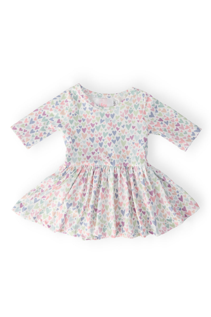 One in a Million 3/4 Sleeve Twirl Bodysuit featured in a charming heart print, ideal for your little one's playful adventures.