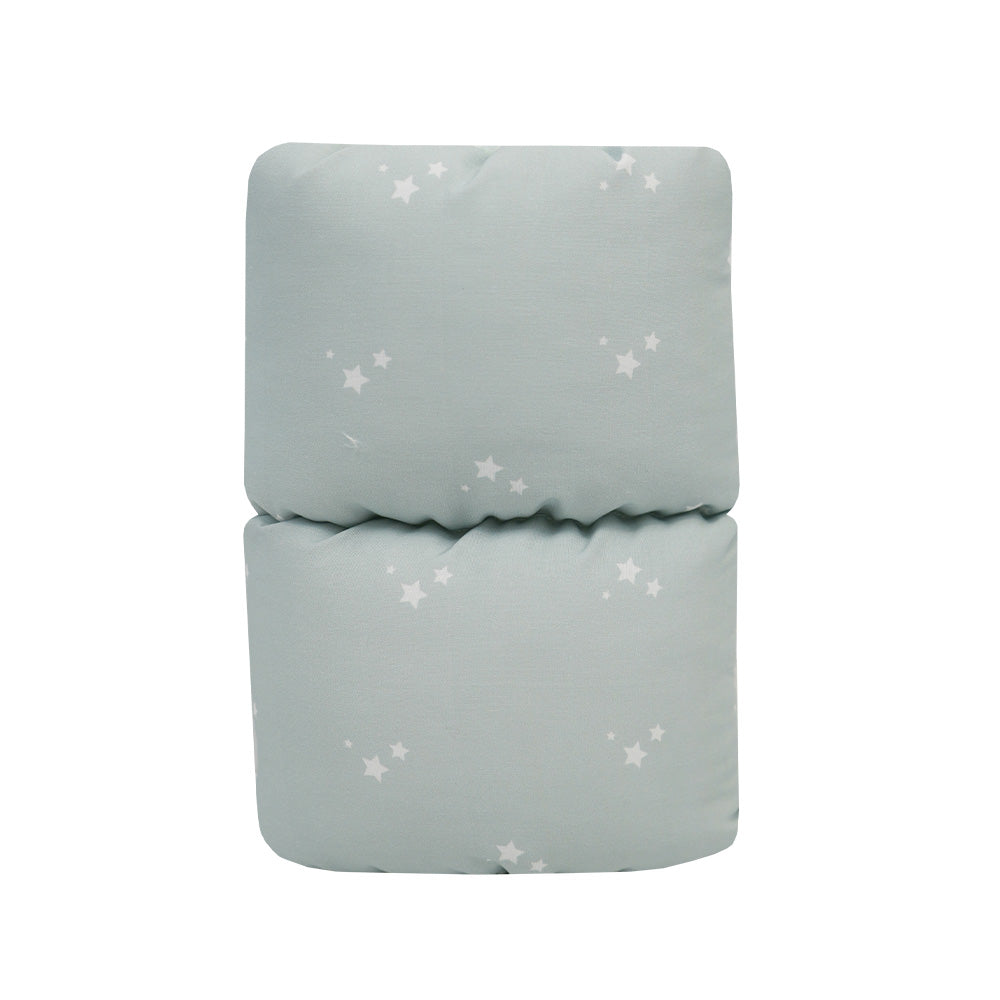Orion Comfy Cradle nursing arm pillow in a folded position, featuring a soothing mint green fabric with star patterns, designed for comfortable feeding support.