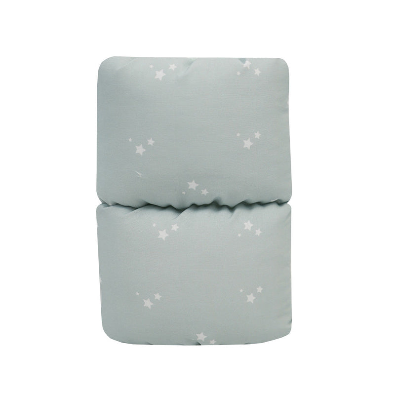 Orion Comfy Cradle nursing arm pillow in a folded position, featuring a soothing mint green fabric with star patterns, designed for comfortable feeding support.