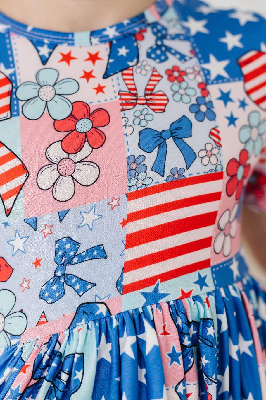 Girls blue pocket twirl dress with red white star and floral print short sleeve