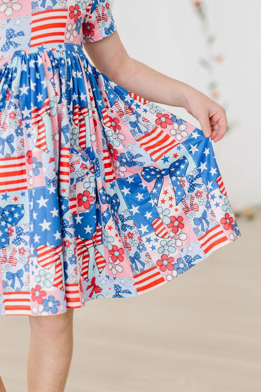 Girls pocket twirl dress by Mila & Rose with red white blue patriotic floral and star print
