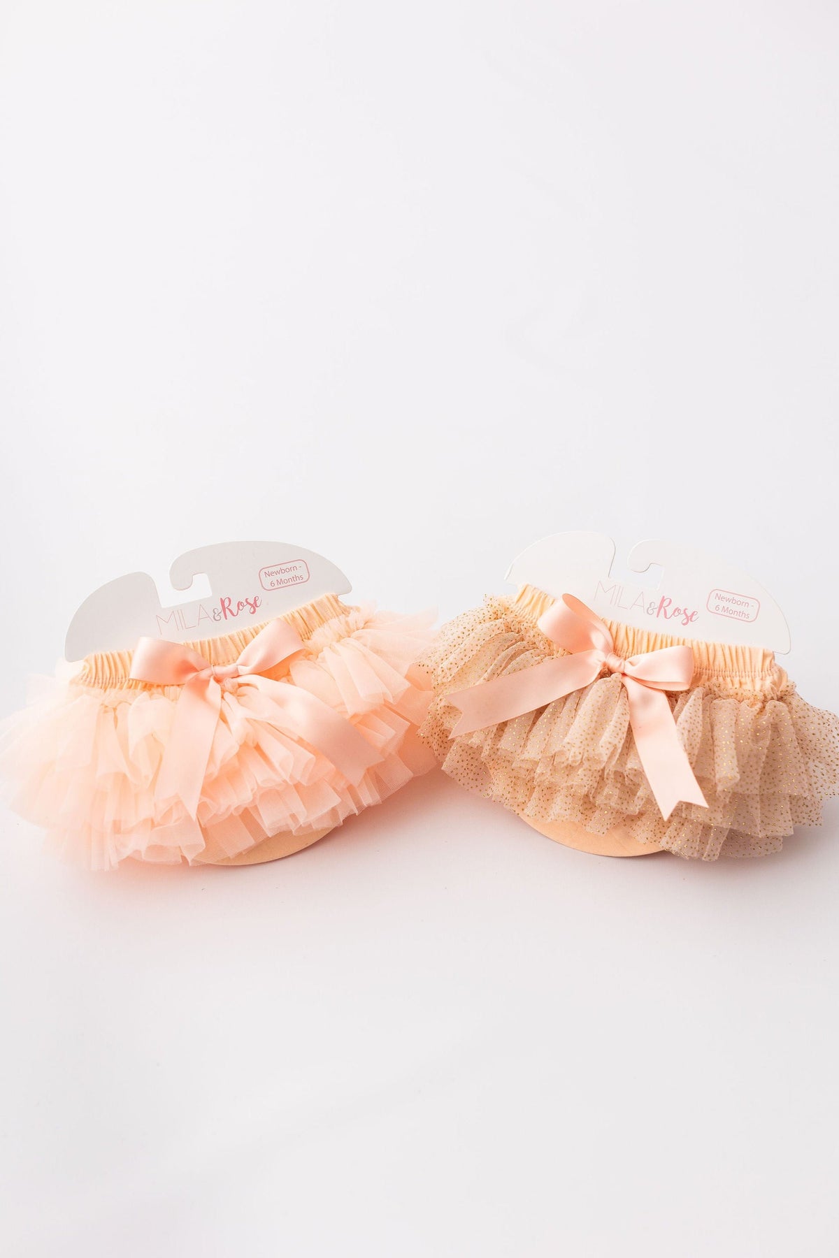 Set of Peach & Gold Glitter Tutu Bloomers by Mila & Rose, highlighting fluffy layers and elegant design for newborns.
