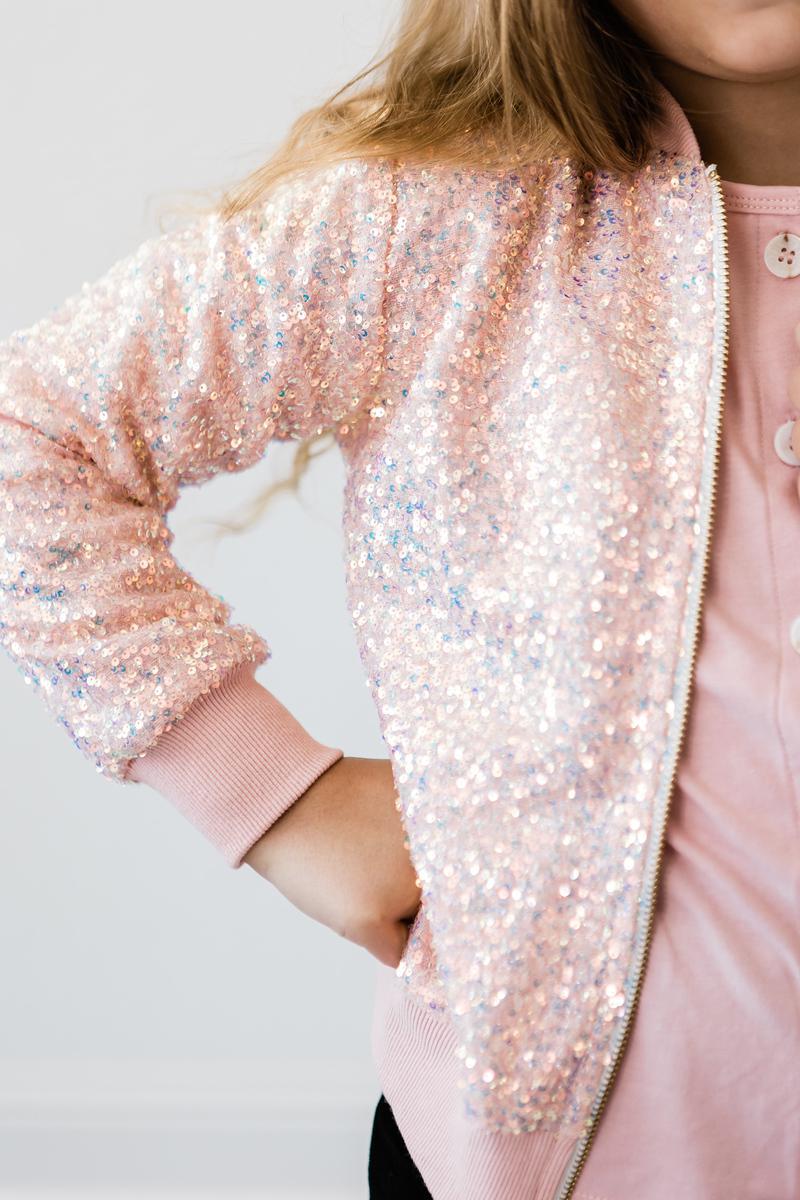 Another close-up of a Peach Sequin Jacket, flaunting its sparkly details and stylish design that every girl wants in her closet.