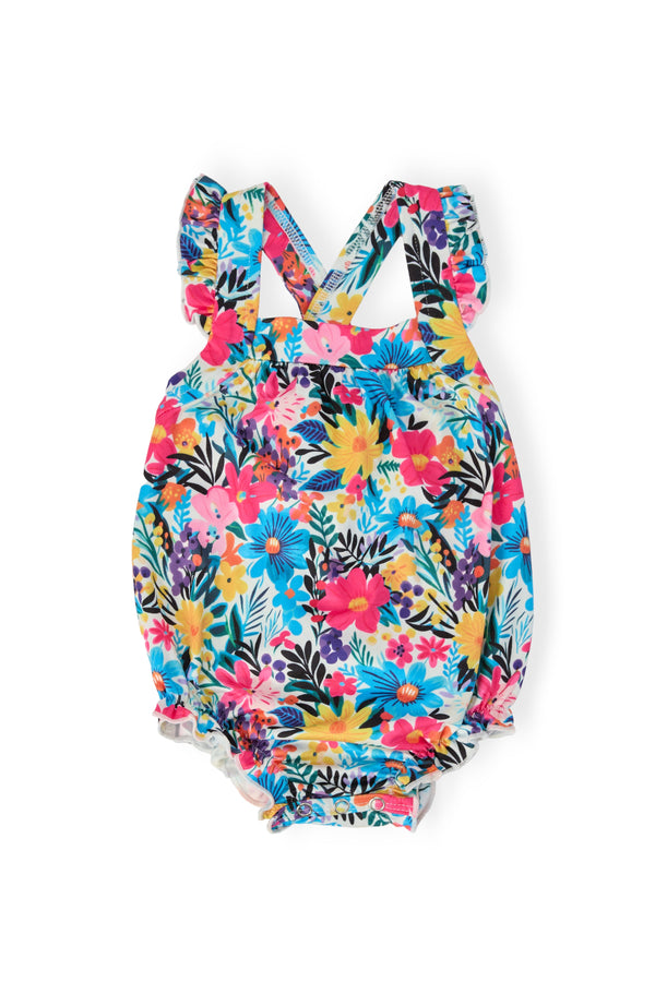Petal Paradise Ruffle Cross Back Romper with bright floral print crisscross back straps and ruffled shoulders