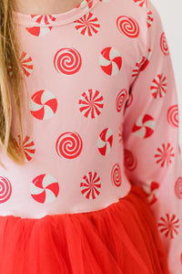 Pink peppermint long sleeve tutu dress featuring candy swirl print top and red tulle skirt for girls.