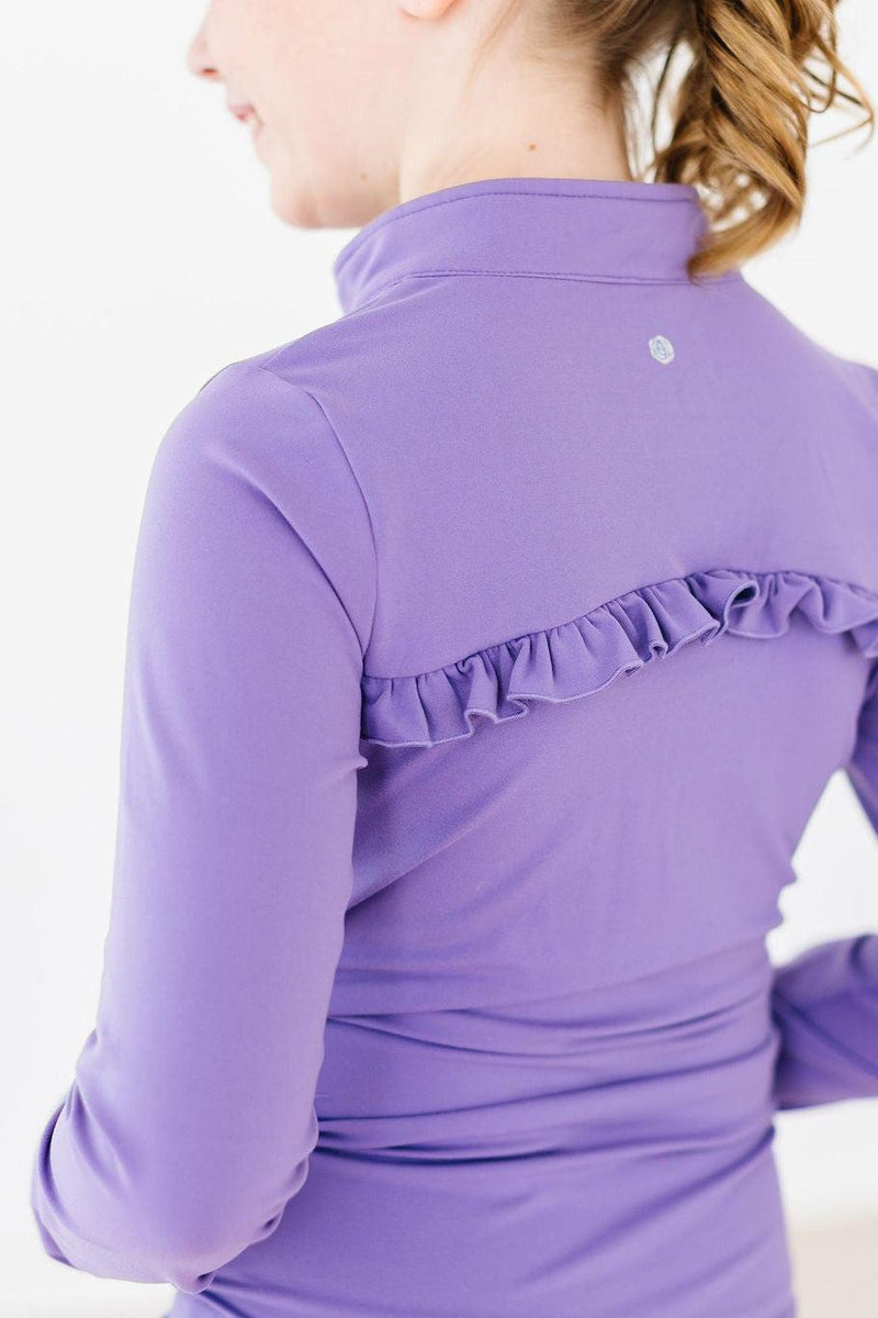 Close-up of the back view of a girl in a Playful Purple Full-Zip Ruffle Girl's Active Jacket highlighting the playful ruffle detail.
