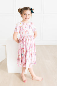 Scoop back and ballet neckline of the Whimsical Rainbow Daisies Short Sleeve Pocket Twirl Dress for Girls, ensuring comfort and style, an adorable twirl dress for girls.