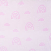 Macro shot of pastel pink background with lighter pink rainbow motifs blending into smooth jacquard weave surface