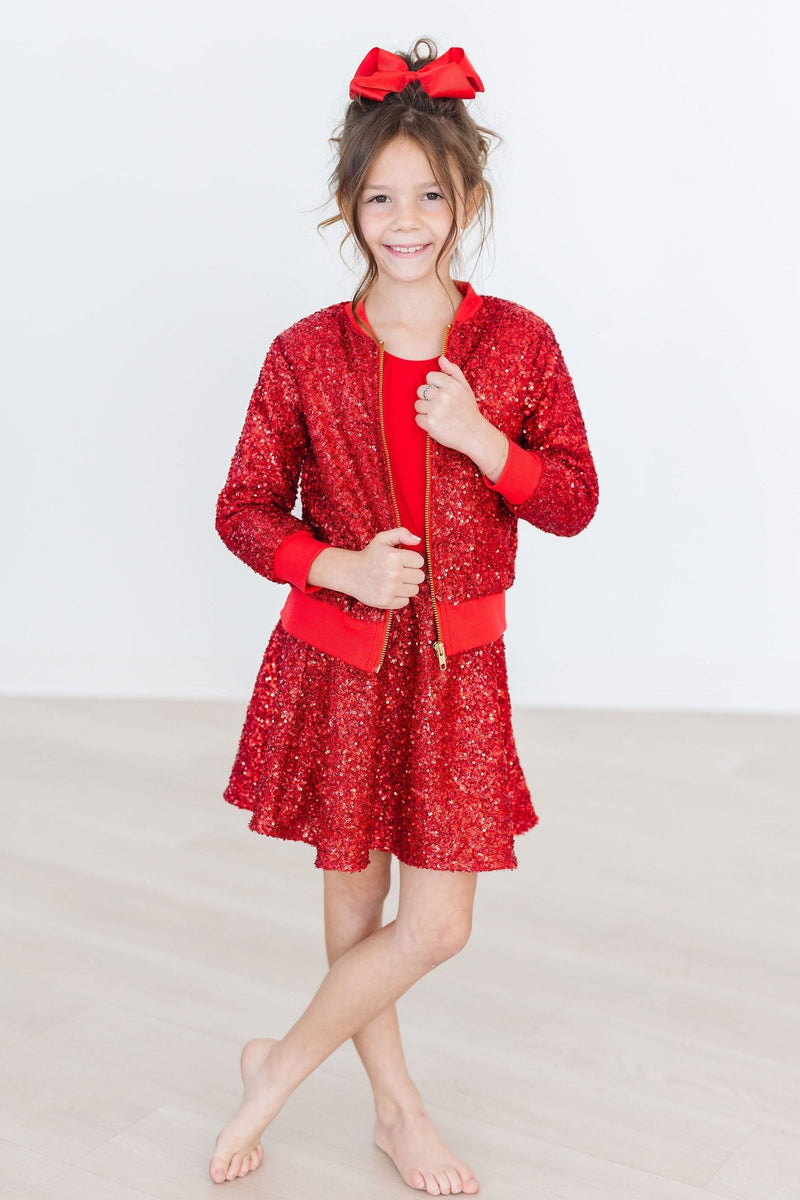 Close-up of the shimmering Red Sequin Jacket, highlighting the vibrant sequins that make every outfit pop.