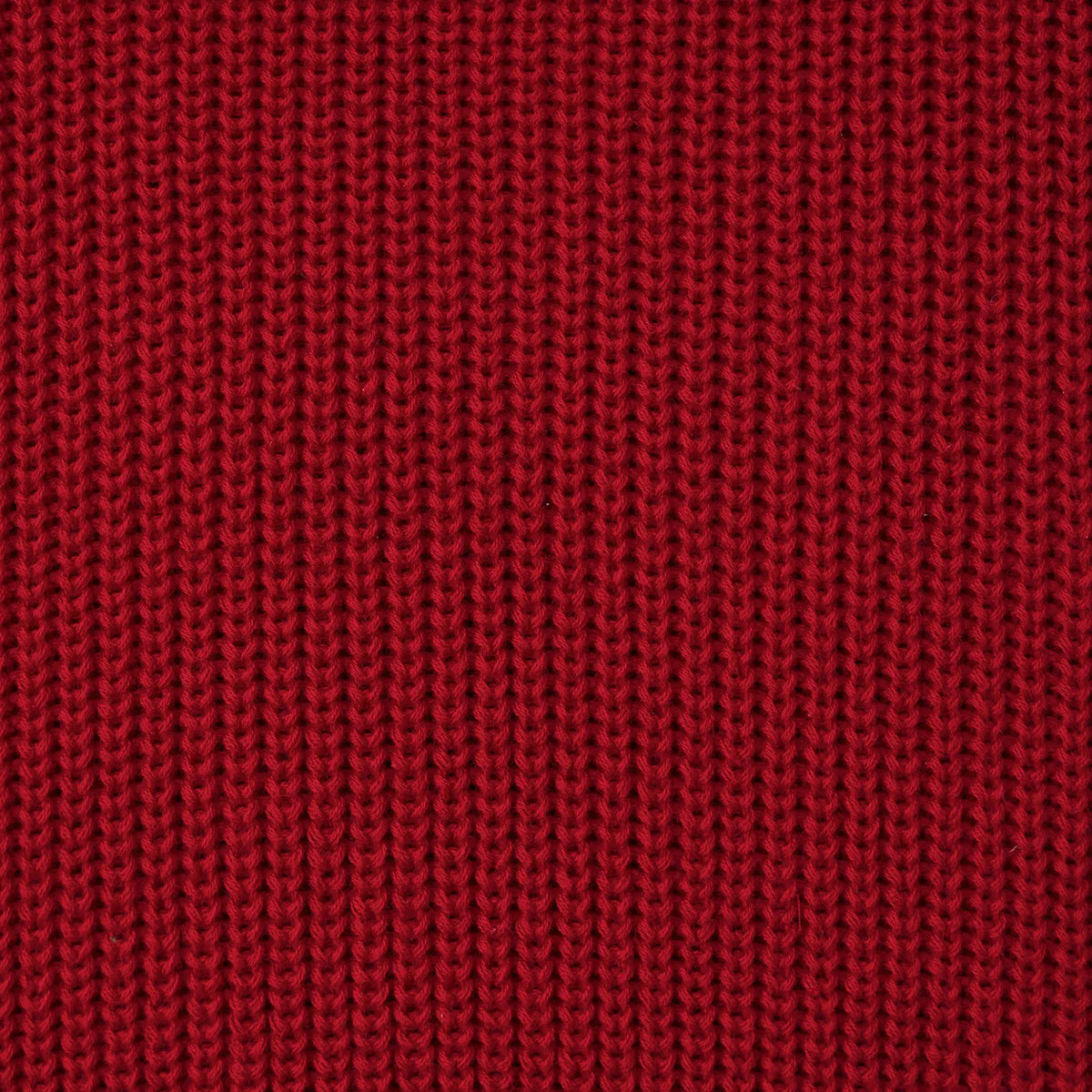 Macro view of deep red tight-gauge knit fabric weave pattern