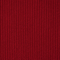Macro view of deep red tight-gauge knit fabric weave pattern