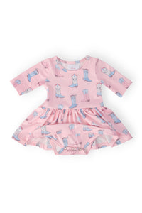 Ribbons & Rodeos pink 3/4 sleeve twirl bodysuit with blue cowboy boot print and diaper-snap closures.