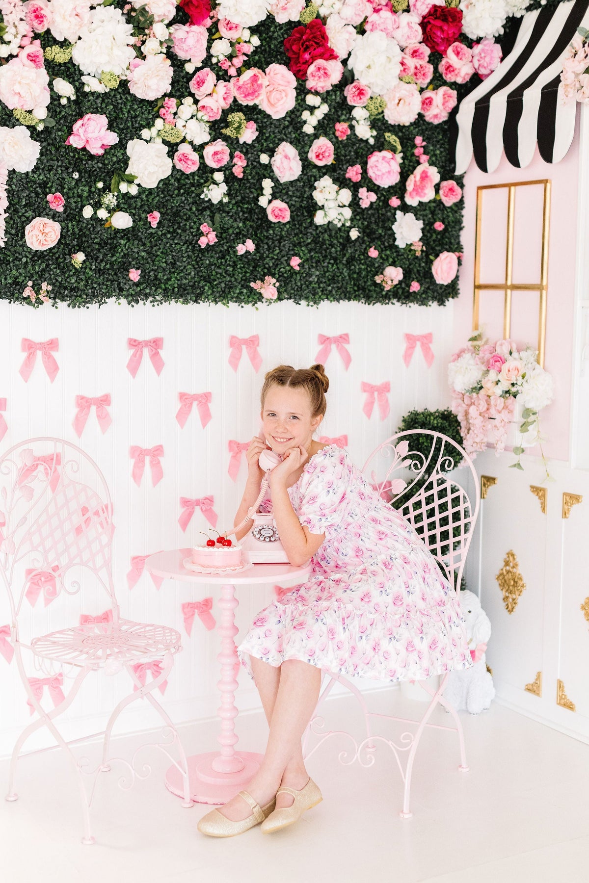 Rose Garden Smocked Ruffle Dress on Mila with a stretchy smocked bodice and ruffle skirt.