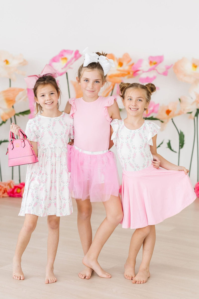 Close-up of the Rosie Posie S/S Pocket Twirl Dress pockets, highlighting the cute details and quality fabric perfect for active playdates.