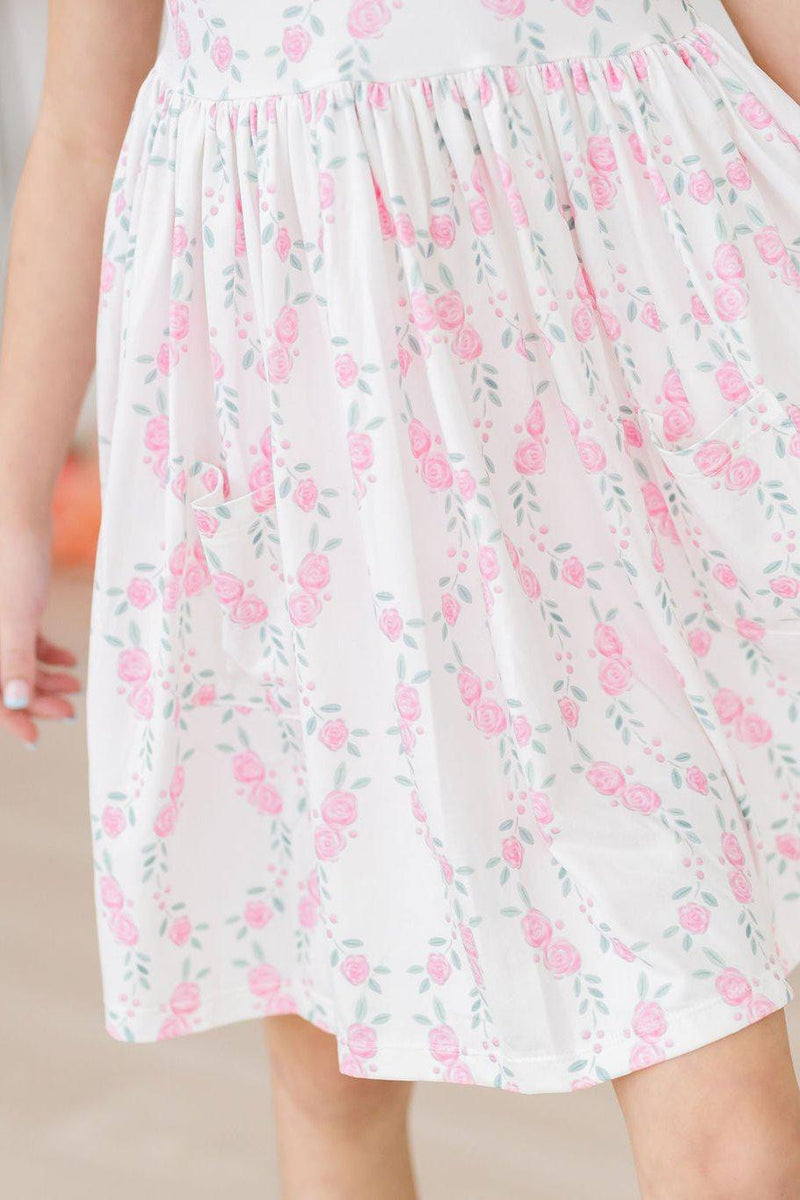 Close-up of the scoop back of the Rosie Posie S/S Pocket Twirl Dress by Mila & Rose, perfect for easy dressing and stylish twirls.