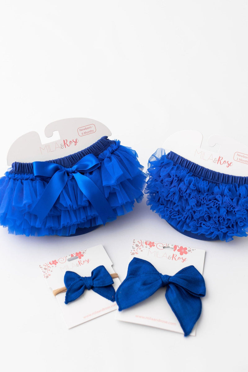 Royal blue ruffle tutu bloomer with satin bow, double-layered ruffles, on white background with Mila & Rose brand cards.