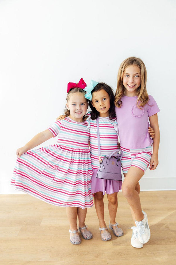Close-up of the Pastel Stripes Short Sleeve Twirl Dress for Girls featuring pockets, ideal girls twirl dress for everyday wear.