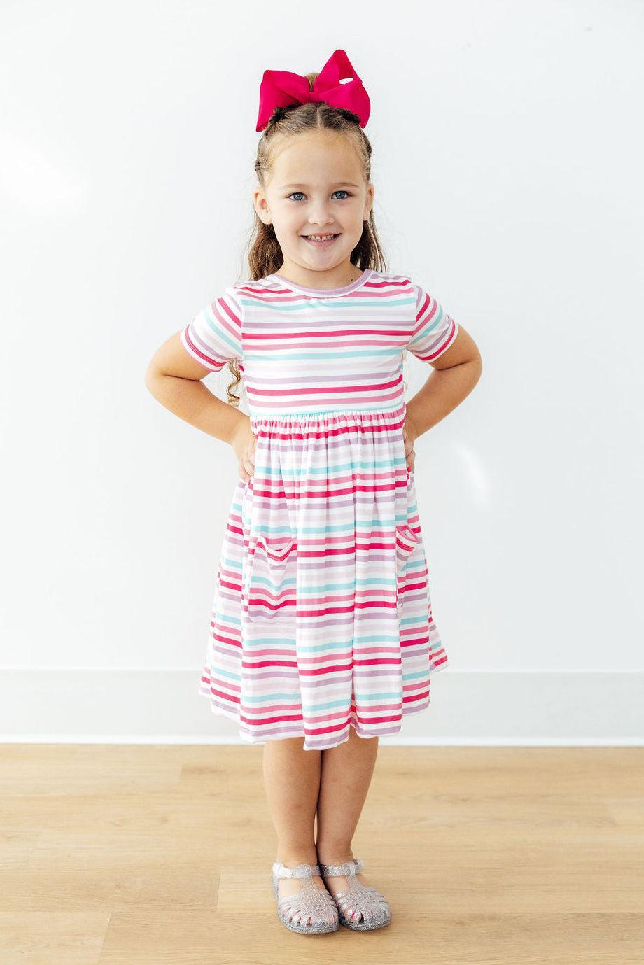 Back view of the Pastel Stripes Short Sleeve Twirl Dress for Girls, emphasizing the easy-on design of this girls twirl dress.